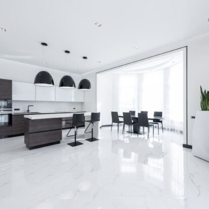 open modern kitchen with white quartz worktops